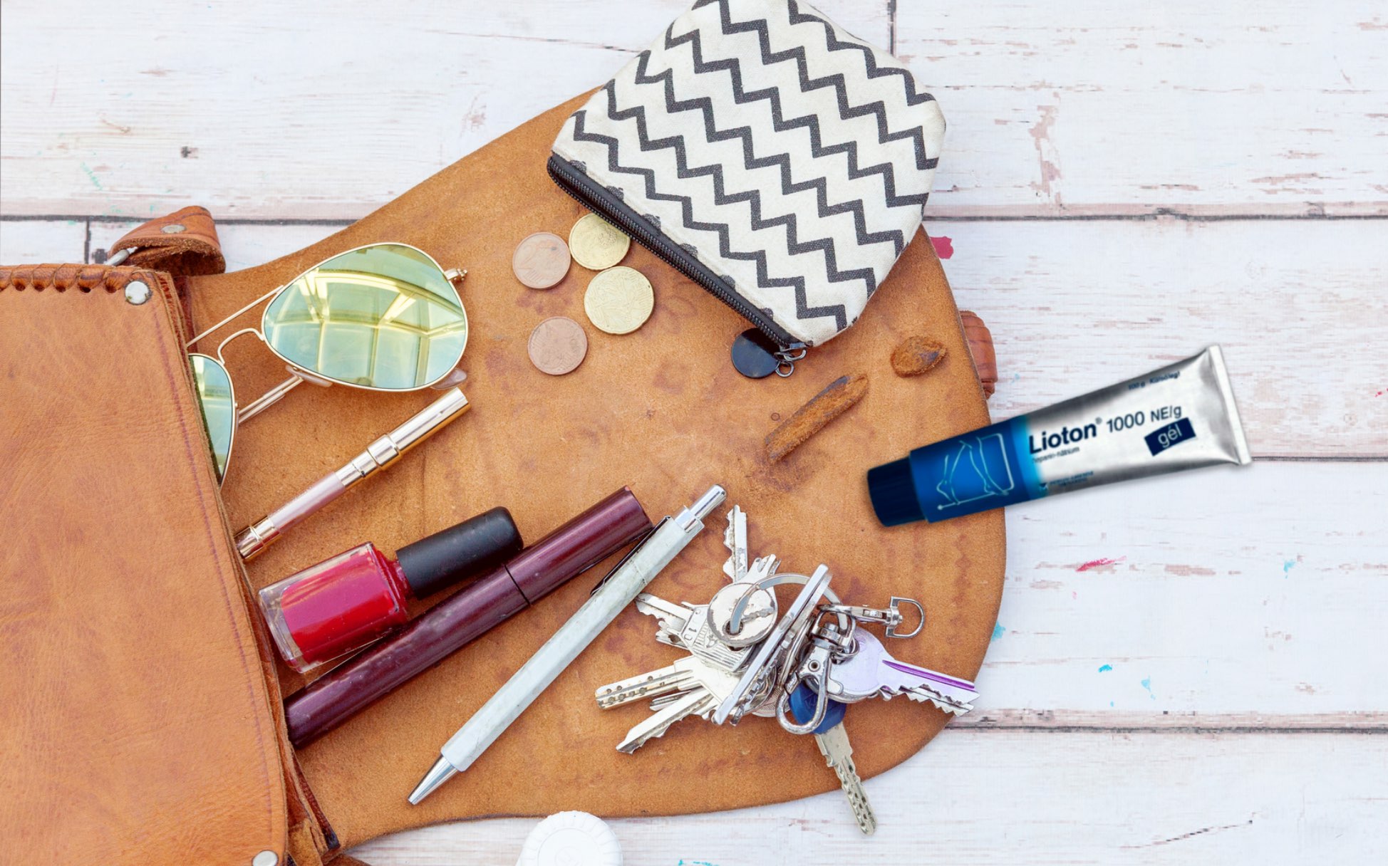A handbag containing Lioton to treat hematomas as they happen on the go